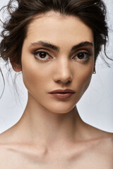 Naklejka premium A close-up portrait of a young woman with a nose ring.