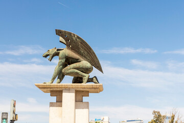 VALENCIA, SPAIN - April 20, 2024: Guardian Gargoyle on Pont del Regne (Bridge of the Kingdom) in Turia Riverbed Gardens