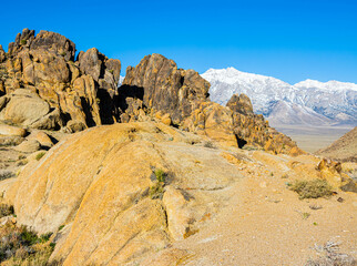 Eroded Fin Formations of The Alabama Hills With The Snow Capped Sierra Nevada Mountains, Alabama Hills National Scenic Area, California, USA
