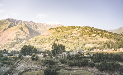 Old low-rise village buildings in villages and auls in the mountains of Tajikistan and Afghanistan on the Pamir Highway