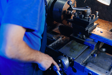 Old master man use milling machine, industrial photography. Concept factories for parts, home workshops in garage