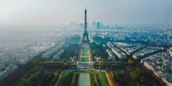 Aerial view of the eiffel tower and champ de mars in paris on a foggy morning
