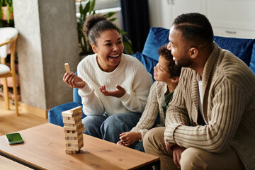 African american family joyfully constructing structures with wooden blocks.