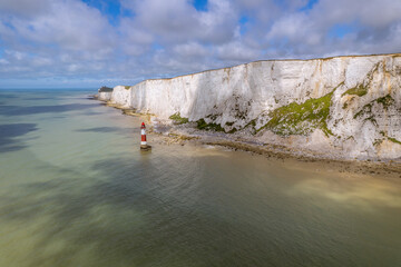 The drone aerial view of lighthouse and white cliffs at Beachy Head, East Sussex, England. Beachy...