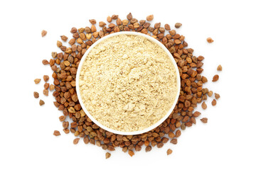 A bowl of Organic Chickpea (Cicer arietinum) Flour, placed over a heap of Chickpeas. Isolated on a white background.