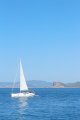 Fototapeta premium Sailboat floating on blue water
