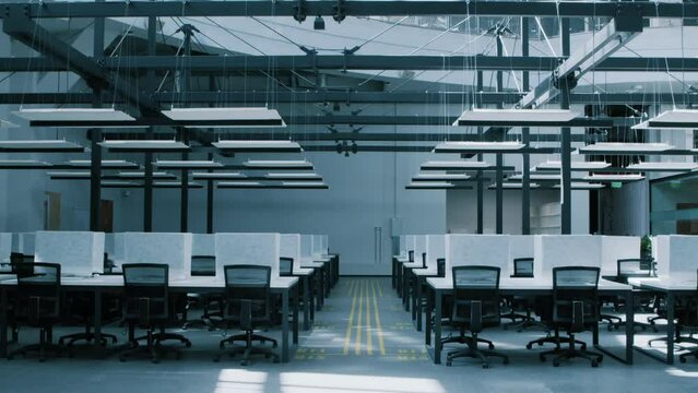 Transition to online business. Interior of empty big workspace with modern covered computers