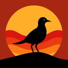 Bird silhouette on the sunset background