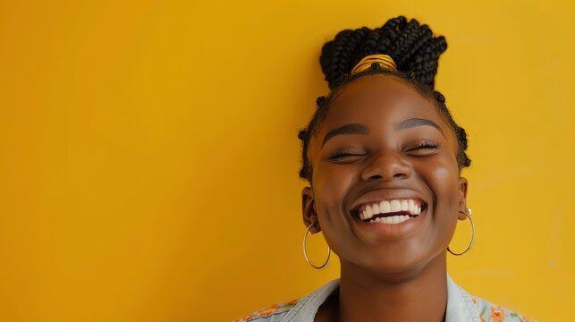 A Cute Black Girl Laughs Sincerely Against A Yellow Background, Her Face Glowing With Joy