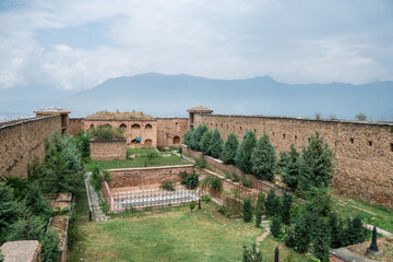 Hari Parbat. A fort is perched atop a hill, proudly flying a flag, Srinagar, Kashmir, India
