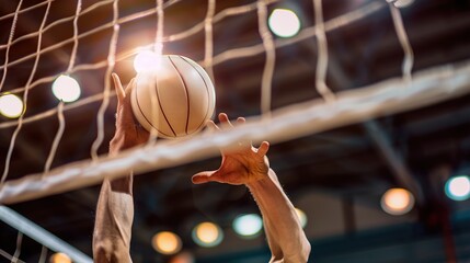 Close-up Volleyball spike hand block over the net