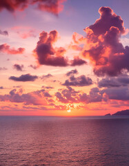Obraz premium Beautiful sunset over the sea. Colorful sky with clouds.