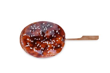 Tsukune, Japanese Chicken Meatball in teriyaki sauce with sesame seeds sprinkles on a white isolated background