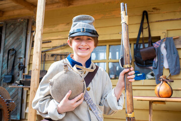 child in historical costume of a South American Confederate soldier