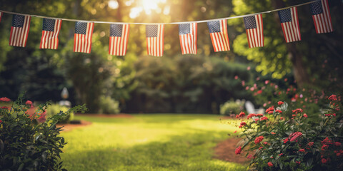 American flag banner decorating a green grass backyard on a sunny day