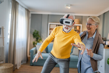 man mature senior male at home enjoy virtual reality VR headset