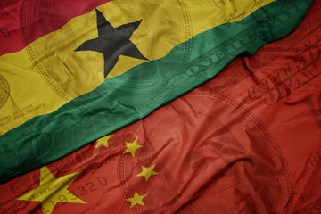 waving colorful flag of ghana and national flag of china on the dollar money background. finance concept.