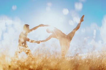 Male and female ballet dancer doing dance poses in long dry grass on Mt Tamalpais, San Francisco, Califormia, United States of America.