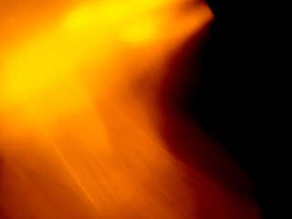 Light orange warm color light leak on dark background for design use and special effects.