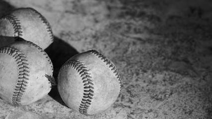 Old baseball balls with nostalgia grunge texture background with copy space for sport in black and white.