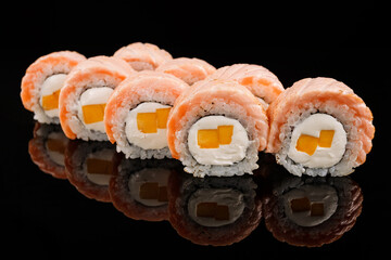 Philadelphia sushi roll with salmon, mango and cream cheese