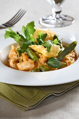 Asparagus risotto with pirarucu and fried cassava chips