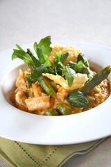 Asparagus risotto with pirarucu and fried cassava chips