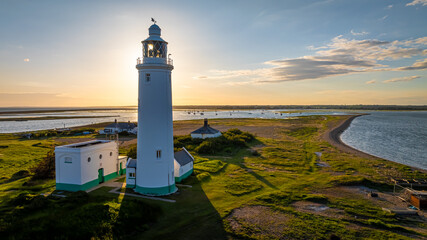 Fototapeta premium Sunset view of Hurst Point Lighthouse is located at Hurst Point in the English county of Hampshire