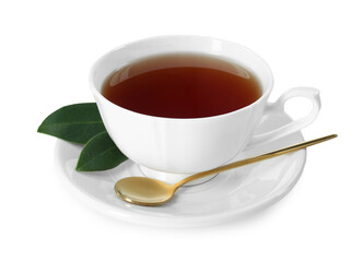 Aromatic tea in cup, golden spoon and green leaves isolated on white