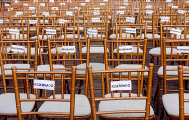 Chairs with signs that say 