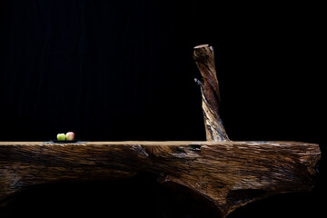 rtistic massive wooden table isolated black on the background