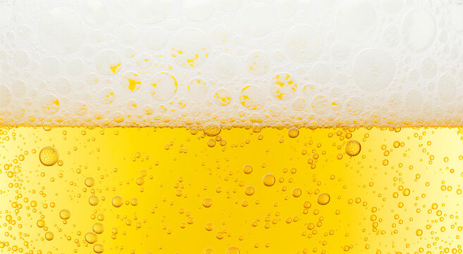 Beer background texture. Close up beer gluss with frothy foam and bubbles