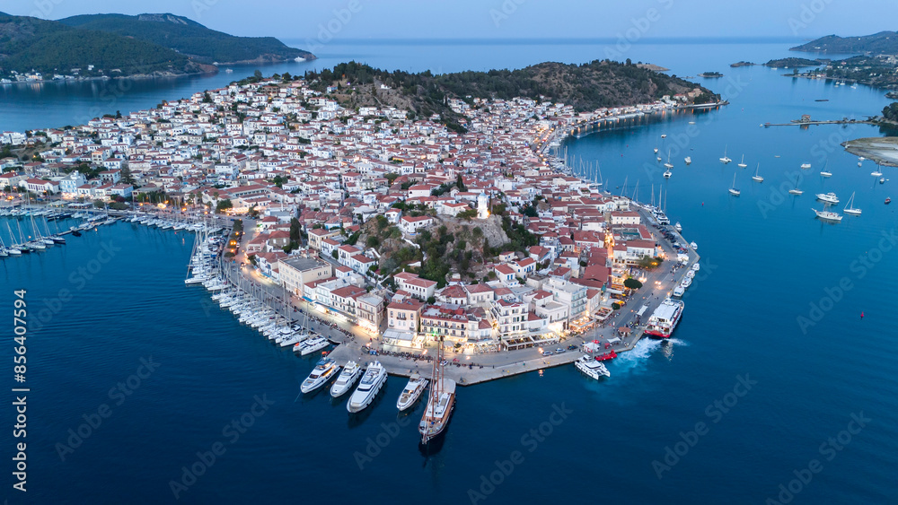 Wall mural Aerial panorama of the city and harbor of Poros island in the Saronic Gulf, Greece, during a colorful summer sunset