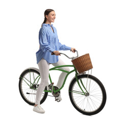 Smiling woman on bicycle with basket against white background