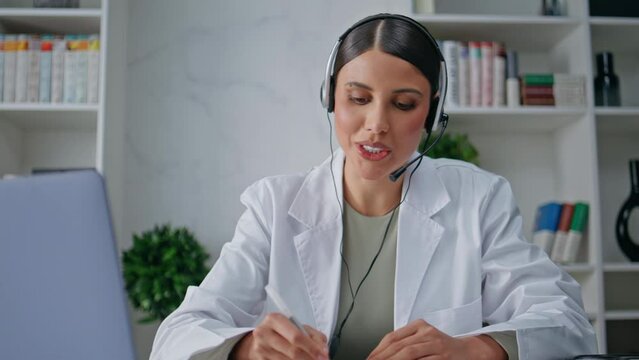Clinic consultant talking headset providing customer service in clinic closeup