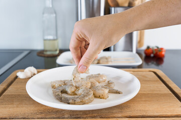 Preparing Marinated Shrimp for Skewering