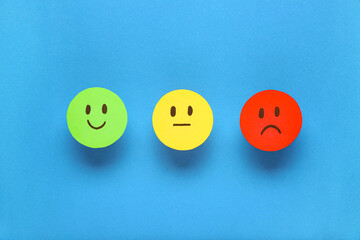 Rating smiles on blue background. Customer experience concept