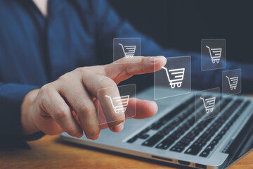 Online shopping, order in online store, shopping on internet, concept on virtual screen with hands typing on keyboard, Man using laptop with shopping cart icon. Online shopping and e-commerce concept.