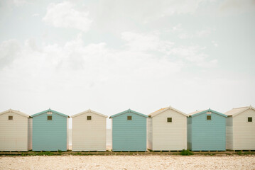 White and blue beach huts side by side