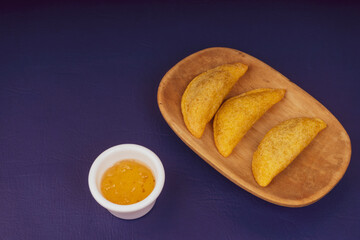 Delicious traditional Colombian empanadas with spicy sauce