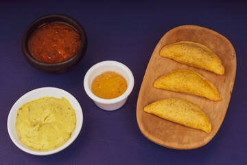 Delicious traditional Colombian empanadas with spicy sauce