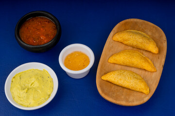 Colombian empanada with spicy sauce 