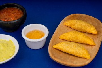 Delicious traditional Colombian empanadas with spicy sauce