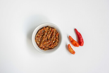Indonesia traditional cuisine sambal bawang or spicy garlic chili sauce served on a white bowl isolated on white background.