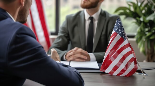 Consul at Consulate of United States of America sitting at office table with American flag and listening to young man telling about his problems with immigration and USA travel visa ap : Generative AI