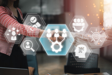 A business handshake with digital interface icons symbolizing teamwork, collaboration, and innovation in a modern office environment.