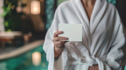 Closeup view of woman in bathrobe holding blank gift card in spa salon : Generative AI