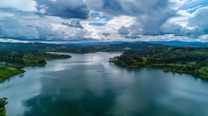 Naklejka premium Aerial view of Embalse de Tomin in Guatavita Cundinamarca Showcasing serene water lush greenery and cloudy skies : Generative AI