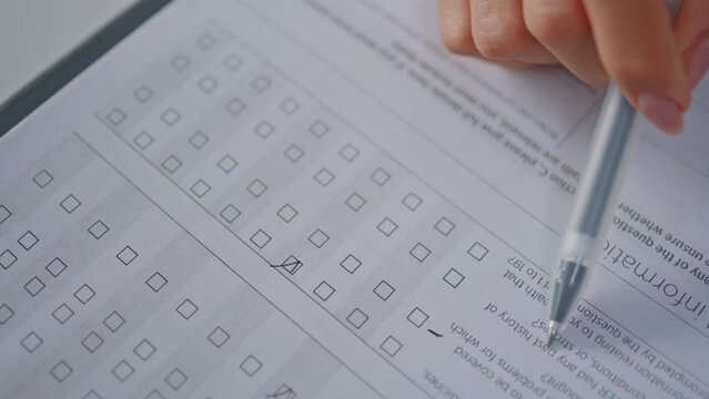 Businesswoman hand filling checklist in office closeup. Woman writing document
