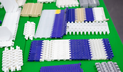 Plastic belt conveyor for food industry production line.